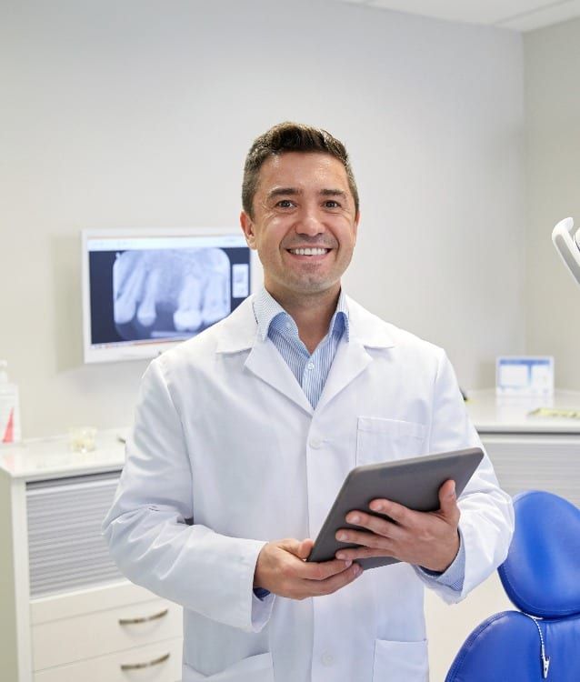 dentist standing in front of an xray