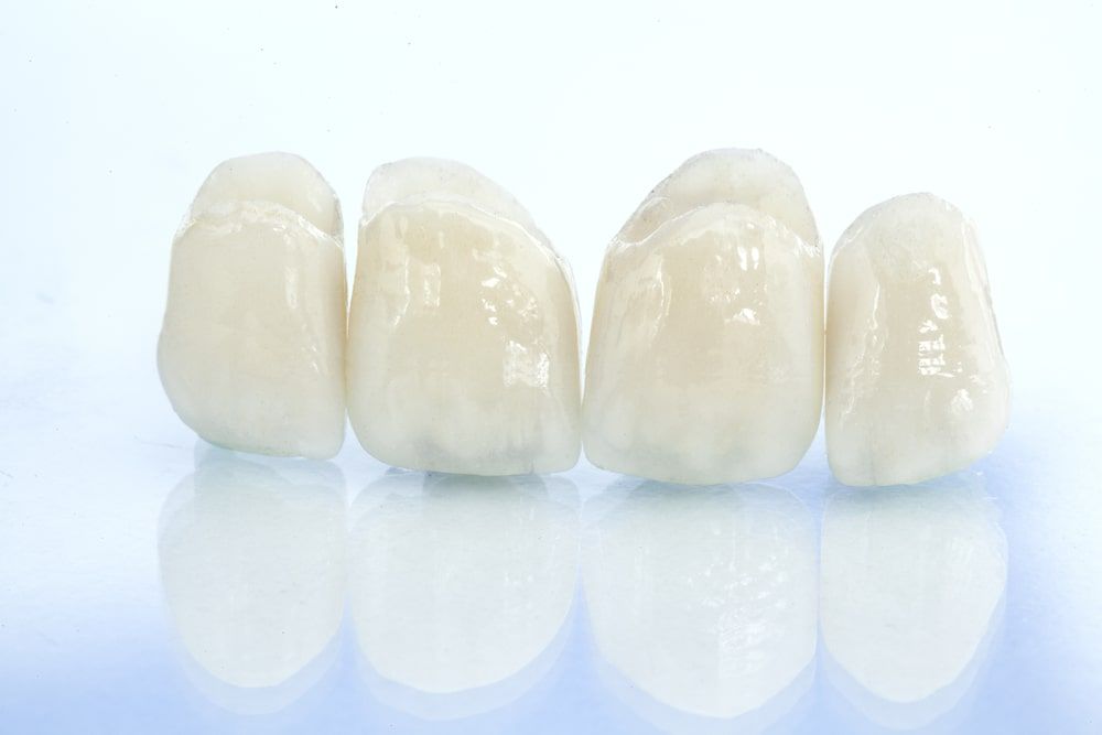 porcelain dental crowns on white background