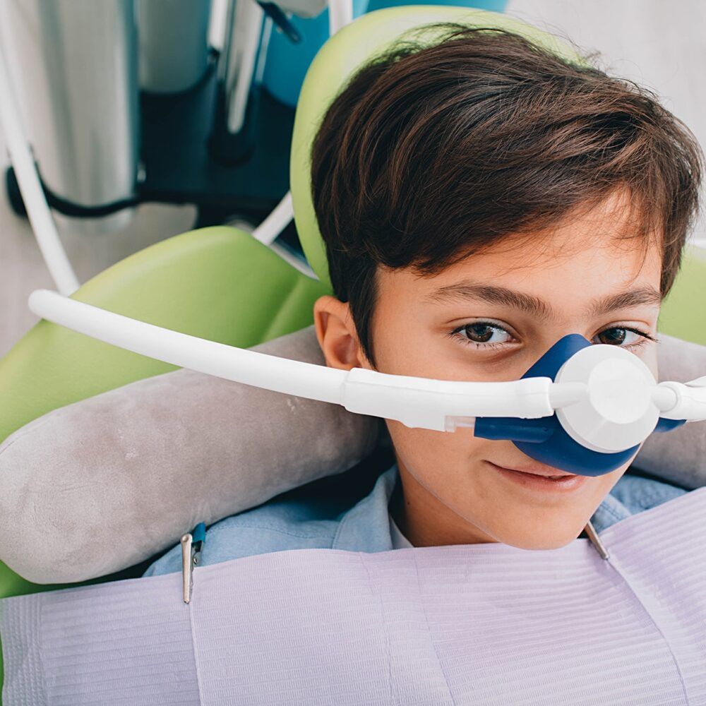 young boy with laughing gas
