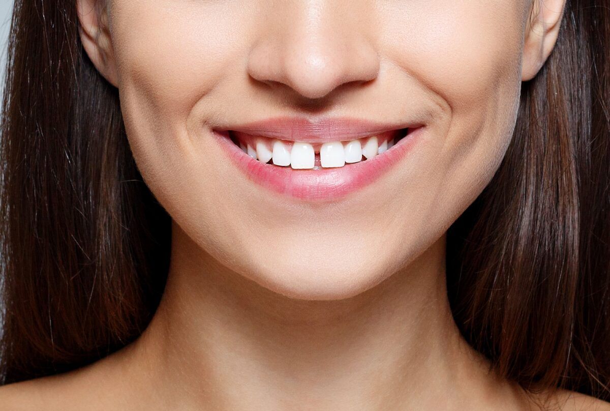 beautiful women smiling with gaps between her teeth